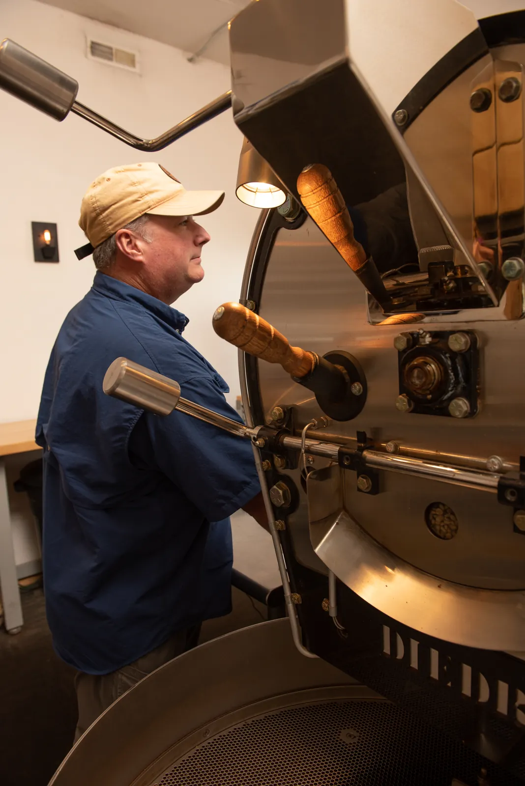 Ken at the roaster in Rapid City—from regular customer to roasting partner and a key member of the Essence of Coffee team.
